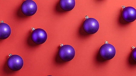 Purple christmas baubles in a regular pattern creating a festive holiday background, symbolizing celebration, gifting, and seasonal cheer for winter eventsの写真素材