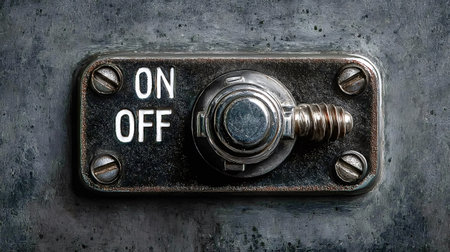 Vintage metallic industrial toggle switch showing on and off labels, representing concepts of...