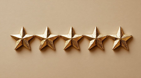 Five shiny gold stars arranged in a row, representing top tier quality, customer review, success, and positive feedback in business or service industriesの写真素材