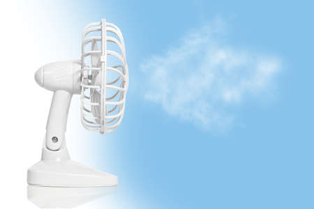 table fan isolated on a sky backgroundの写真素材