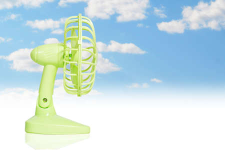 table fan isolated on a sky backgroundの写真素材