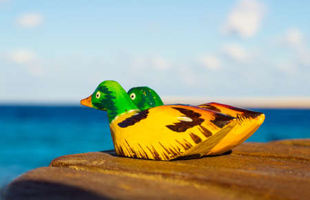 wooden figurines mandarin duck  の写真素材
