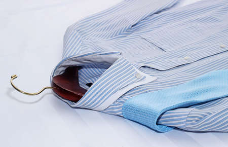 Men's classic shirts on the bed.の写真素材