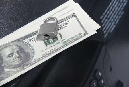 dollars on a closed safeの写真素材