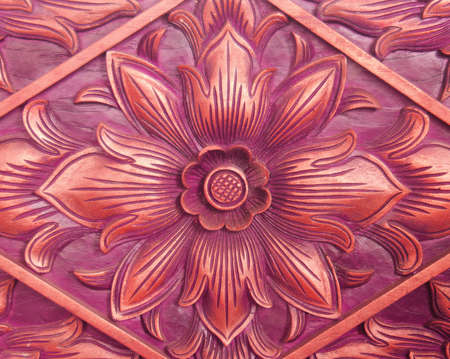 Pattern of flower carved on wood background. hand made in asiaの写真素材