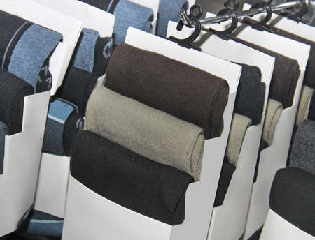 Variety of socks on stands in mall