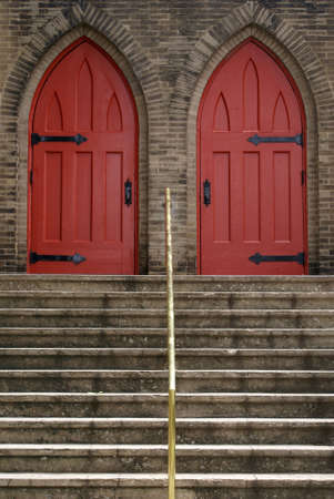 Stairs leading up to double church doors.              の写真素材
