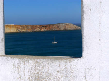 Sailboat throw the window - Sagres - Portugalの写真素材