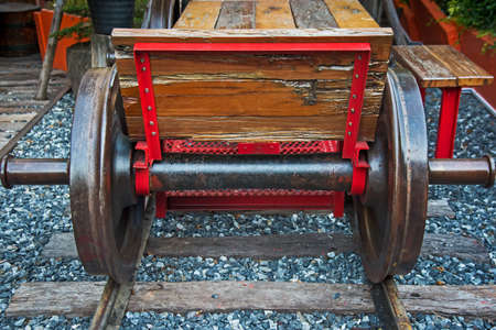 The bench, made of train wheels. Placed over railroad tracks beautifully.の写真素材