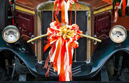 ROTHENBURG, GERMANY / EUROPE - November 17: Old fashioned red bus with a ribbon for the wedding ceremony in Thailand on November 17, 2014.のeditorial素材