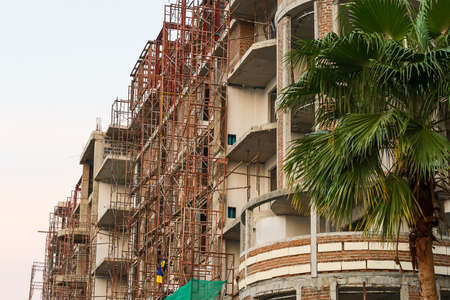 Construction of new buildings with red bricks.