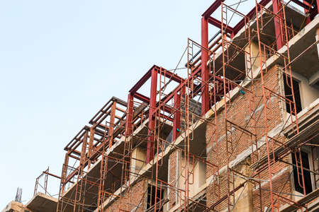 Construction of new buildings with red bricks.