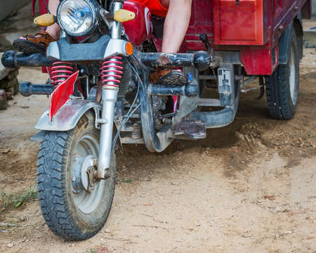 The front wheel of a tricycle.