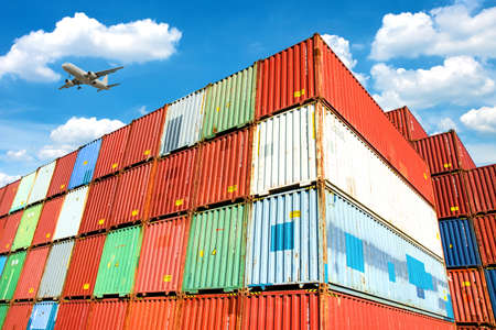 Stacked cargo containers in storage area of freight sea port terminalの写真素材