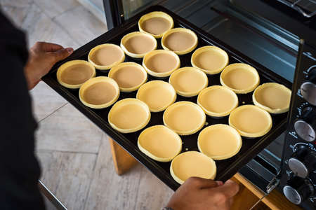 Egg tart, are being put to bake.の写真素材