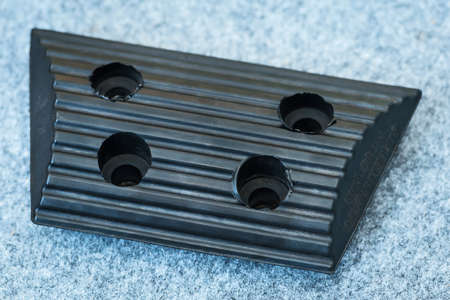 Black wheel chock or wheel stopper.の写真素材