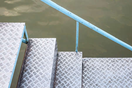 The bridge of the Folk on the river, the ladder comes down from it.の写真素材