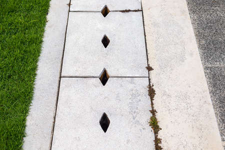 Drain cap on the concrete floor.の写真素材