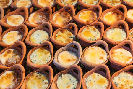 Fresh baked Khanom mo kaeng or Thai dessert made of eggs and sugar in a small Clay pot. Delicious...