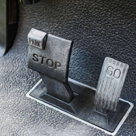 Brake pedal and accelerator of golf cart.