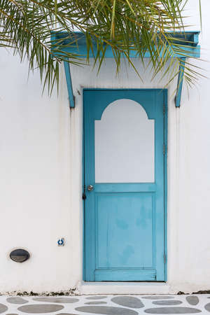 Traditional blue wooden door in the small village.の写真素材