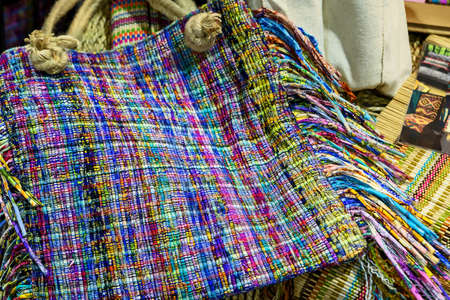 Colorful women bag The idea is to remove the remaining pieces of cloth, cut into strips and knit them into fabrics. Then cut into women bags.の写真素材