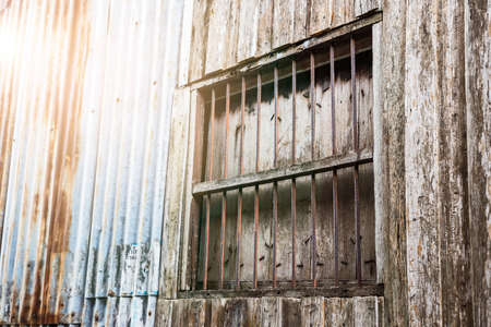 Backgrounds of vintage metal sheet and wood with old windowの写真素材