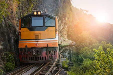 Kanchanaburi, Thailand - 12 December 2014: The train on the Bridge over the River Kwai at Kanchanaburi, Thailand. The Bridge on the River Kwai was built during World War 2.のeditorial素材