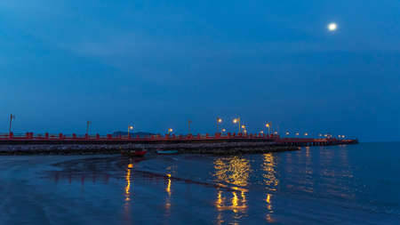 The red bridge and the people who exercise Walk to see the view at Prachuap Bay in the evening time...