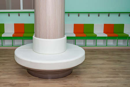Colorful bench for kindergarten children, under the bench there is also a shoe storage box.