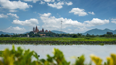 Wat Tham Suea (Wat Tham Suea), Kanchanaburi Province, Thailand, with a river in the foreground. It is a temple that is very popular with tourists and foreigners.の写真素材