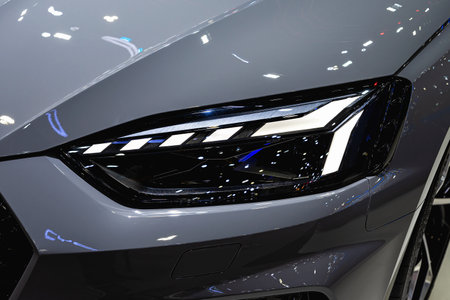 All LED adaptive headlights of a modern car. Headlight consists of individual matrix LED units that can be switched on, off, or dimmed, depending on driving conditionsの写真素材