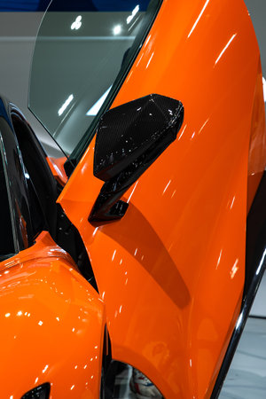 A car side mirror or door mirror is built on the car's exterior to help the driver see areas behind and to the sides of the vehicle.の写真素材
