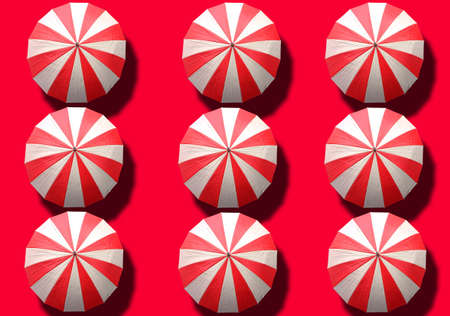 Top view, Collection of white and red umbrella isolated on red background, stock photo, invesment, business, summerの写真素材