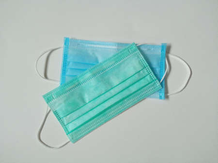 Blue and green face mask isolated on white background, equipment is use to protective , Medicalの写真素材