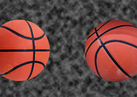 Two new basketball isolated blurred black background for stock photo or illustration, match play, team, sport equipmentの写真素材