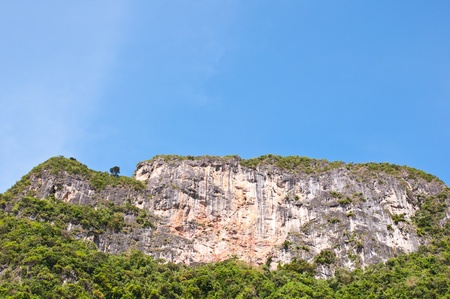 the big limestone mountain with blue sky backgroundの写真素材