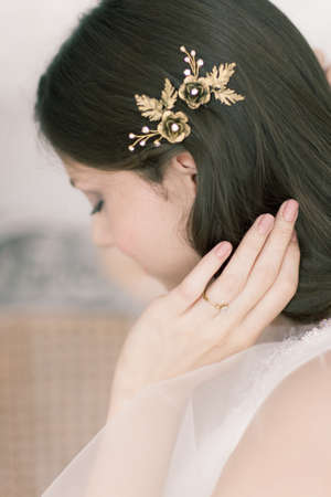 Beautiful Bride Portrait wedding makeup hairstyle, gorgeous young woman in white dress at homeの写真素材