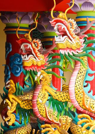 dragons wrapped around the pole in chinese templeの写真素材
