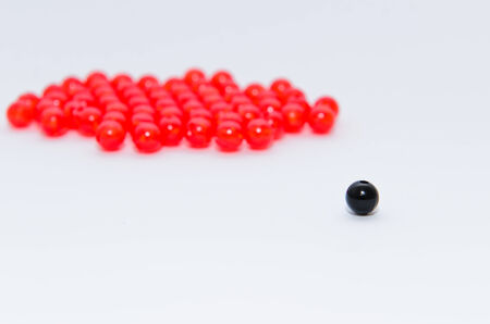 Black and red bead on white backgroundの写真素材