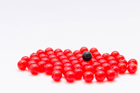 Black and red bead on white backgroundの写真素材