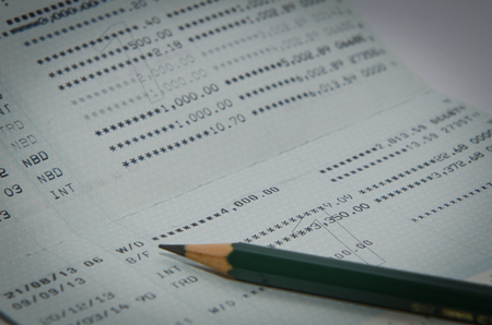 Saving account passbook with pencil