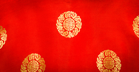 red chiness fabric textile backgroundの写真素材