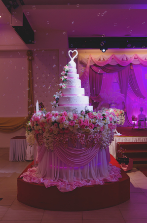 wedding ceremony cake decoration with rose flower at hallの写真素材