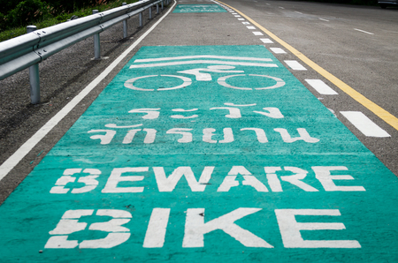 bike lane symbol share with street car in a park の写真素材