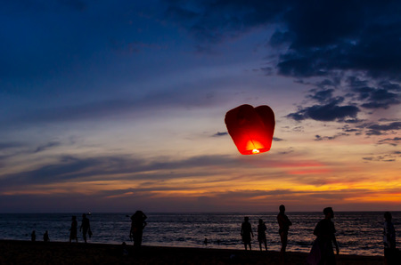 traveller waiting sunset and lantern on the beach at Phuket, Thailand on 17 February 2018の写真素材
