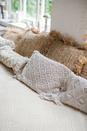 Light boho bedroom with vintage boho details and big windows