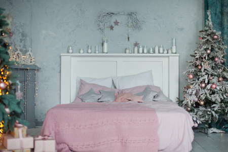 Christmas bedroom with pink and gray decorationの写真素材