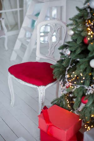 vintage chair near Christmas treeの写真素材