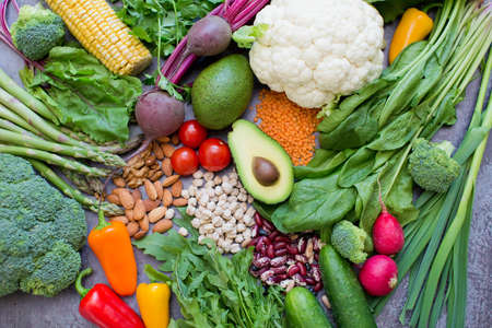 Fresh healthy vegetarian food background. Vegetarian food concept. Vegetables, nuts, beans and...